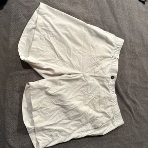 White pair of Under Armour golf alshorts